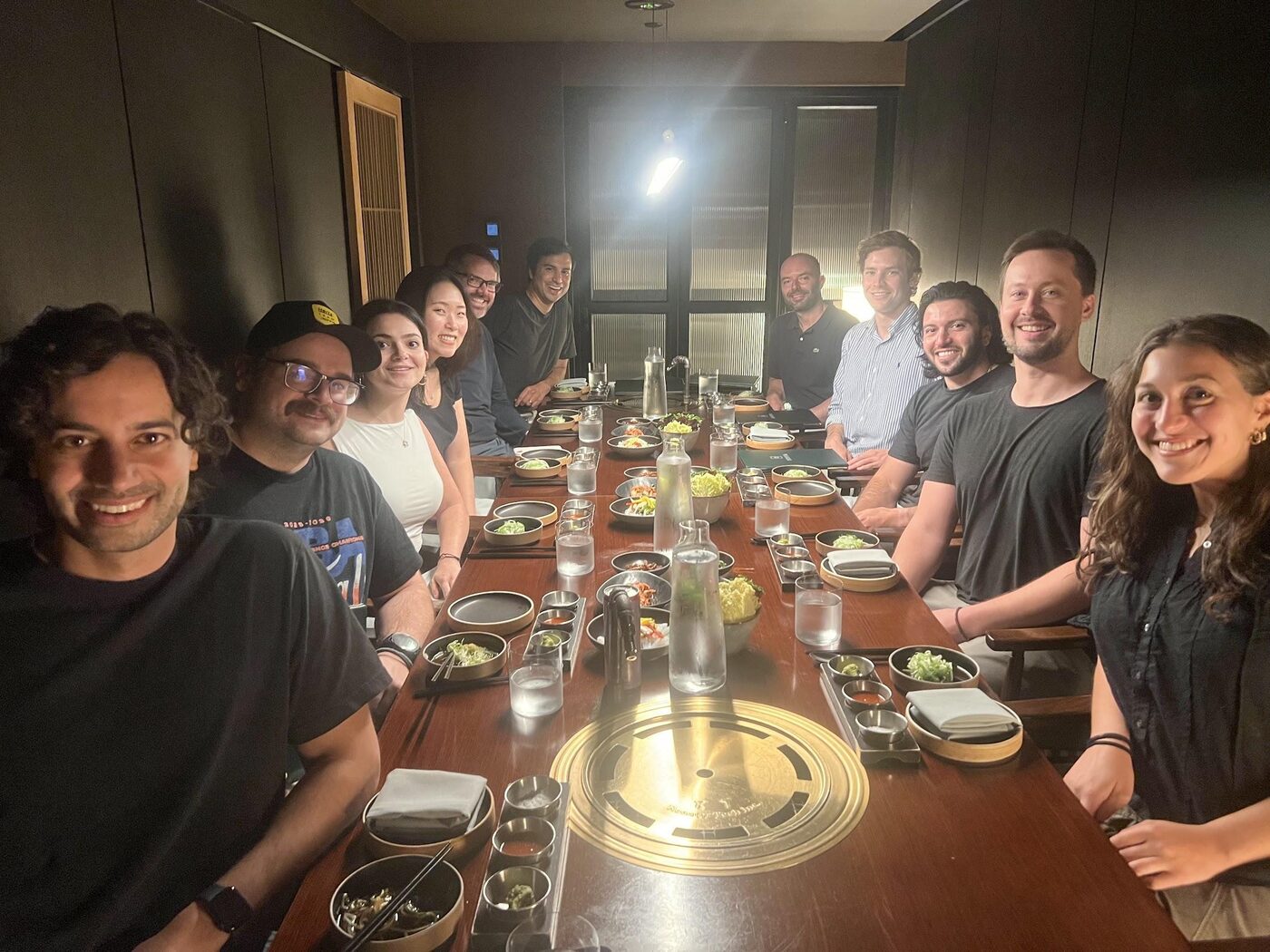 The Coral team gathered around a long table for a team dinner